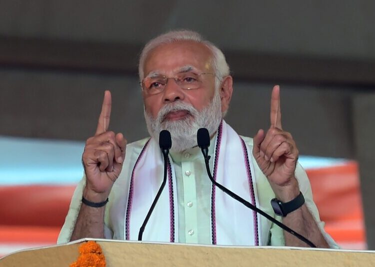 Indian Prime Minister Narendra Modi speaks during a 'Panchayat Raj', the system of local self-government of villages in rural India, in Ahmedabad on March 11, 2022. (Photo by SAM PANTHAKY / AFP)